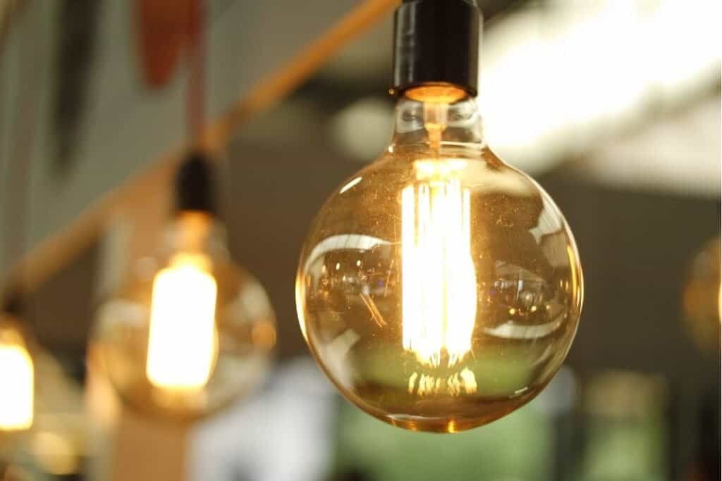 Vintage Edison style light bulbs hanging with warm ambient lighting, ideal for sustainable and eco-friendly home decor.